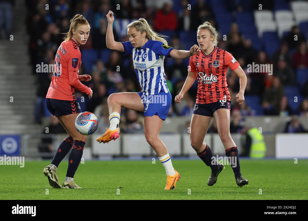 Brighton, UK. 19th Apr, 2024. Brighton's Poppy Pattinson (Centre)challenges Everton's Karen Holmgaard (L) during the Women's Super League match between Brighton & Hove `Albion and Everton at the American Express Stadium. Credit: James Boardman/Alamy Live News Stock Photo
